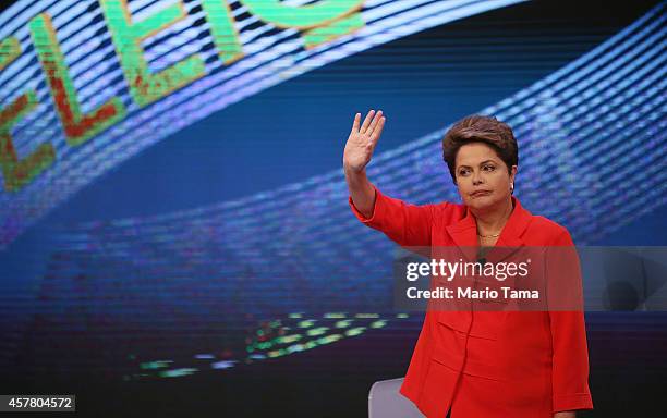 Brazilian President and Workers' Party candidate Dilma Rousseff waves to the audience prior to the debate with Presidential candidate of the...