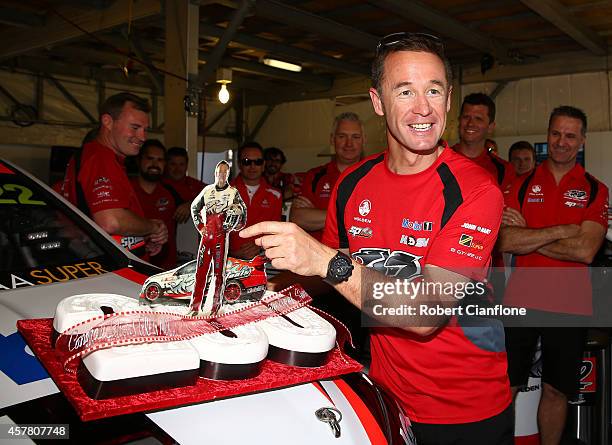 Greg Murphy driver of the Holden Racing Team Holden is presented with a cake for his 200th race start prior to the Gold Coast 600, which is round 12...