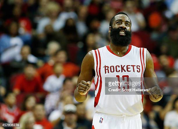 James Harden of the Houston Rockets reacts after a missed three-point shot during their preseason game against the San Antonio Spurs at Toyota Center...