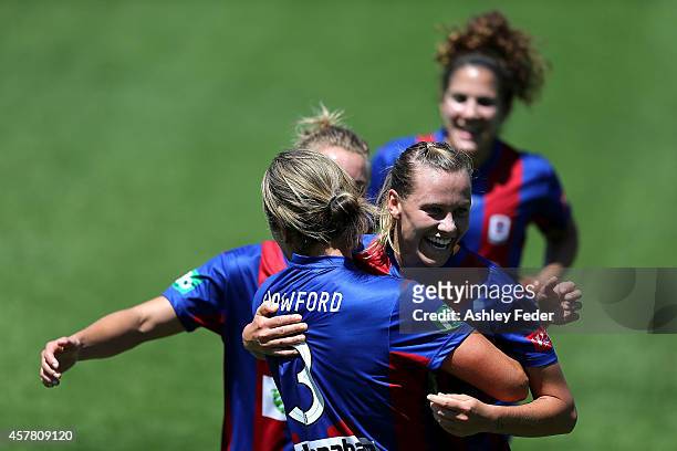 Emily van Egmond of the Jets celebrates a goal with team during the round seven W-League match between Newcastle and Brisbane at Magic Park on...