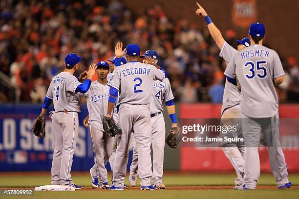 The Kansas City Royals celebrate the 3-2 victory against the San Francisco Giants during Game Three of the 2014 World Series at AT&T Park on October...