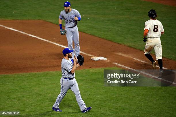 Eric Hosmer and Greg Holland of the Kansas City Royals celebrate the Royals 3-2 victory against the San Francisco Giants during Game Three of the...