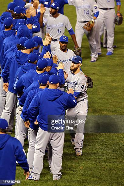 Alex Gordon of the Kansas City Royals celebrates with teammates after defeating the San Francisco Giants in Game Three of the 2014 World Series 3-2...