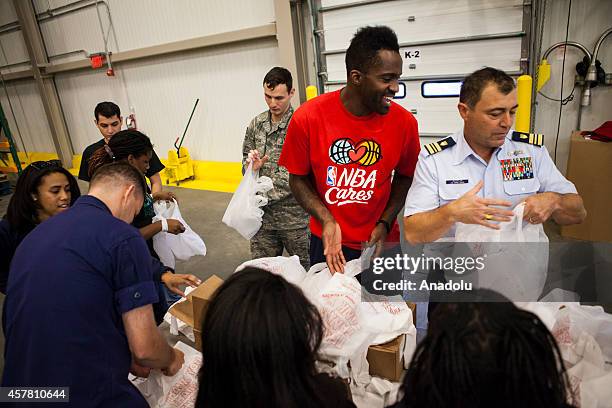 Washington Wizards player Martell Webster helps pack bags at the Capital Area Food Bank in support of the Weekend Bag Program in Washington, D.C. On...