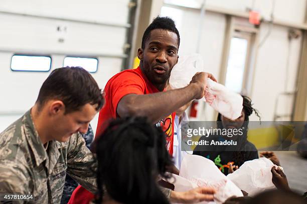 Washington Wizards player Martell Webster helps pack bags at the Capital Area Food Bank in support of the Weekend Bag Program in Washington, D.C. On...