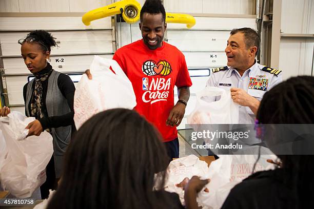 Washington Wizards player Martell Webster helps pack bags at the Capital Area Food Bank in support of the Weekend Bag Program in Washington, D.C. On...