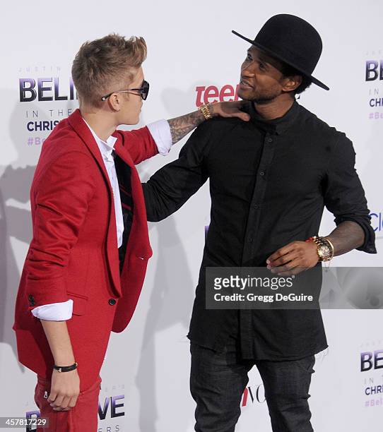 Singers Justin Bieber and Usher arrive at the world premiere of "Justin Bieber's Believe" at Regal Cinemas L.A. Live on December 18, 2013 in Los...