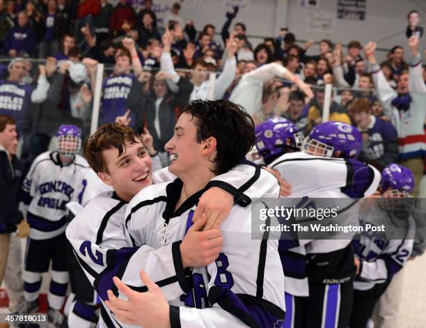 Gonzaga players Ridge Slater, left, and Bobby Hally, right, celebrate after winning the MAPHL Ice Hockey Championship at the Gardens Ice House in...