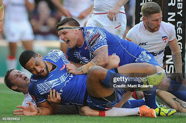 Isaac Liu of Samoa celebrates scoring a try with Josh McGuire during the Four Nations match between England and Samoa at Suncorp Stadium on October...