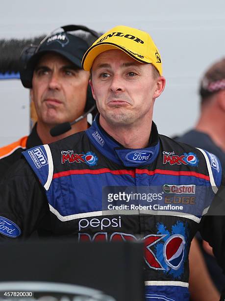 Mark Winterbottom driver of the Pepsi Max Crew Ford looks on after he was disqualified from third place after race 31 for the Gold Coast 600, which...