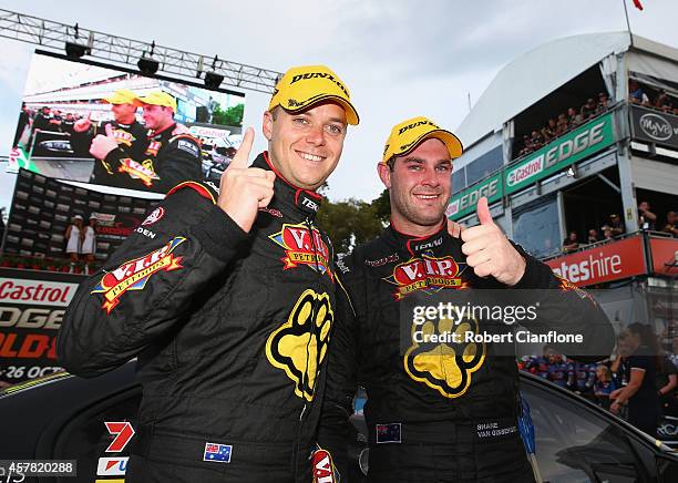 Shane van Gisbergen driver of the TEKNO VIP Petfoods Holden celebrates with co-driver Jonathon Webb, after winning race 31 for the Gold Coast 600,...