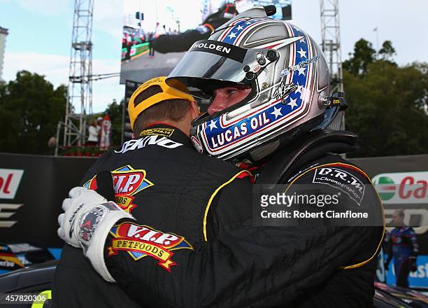 Shane van Gisbergen driver of the TEKNO VIP Petfoods Holden celebrates with co-driver Jonathon Webb, after winning race 31 for the Gold Coast 600,...