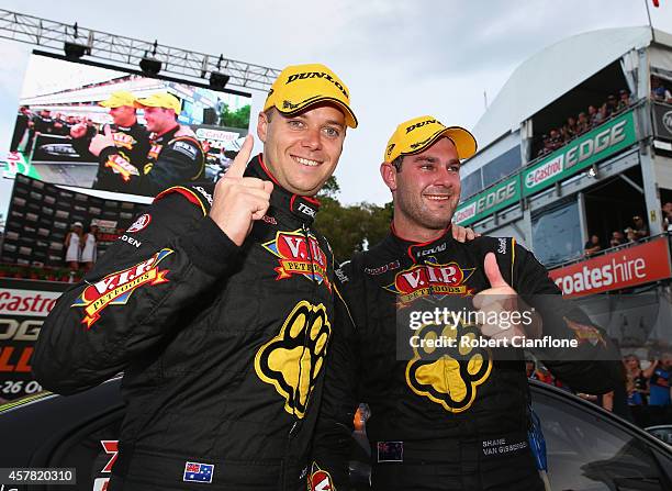 Shane van Gisbergen driver of the TEKNO VIP Petfoods Holden celebrates with co-driver Jonathon Webb, after winning race 31 for the Gold Coast 600,...