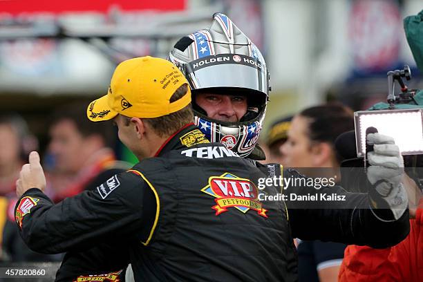 Shane van Gisbergen and Jonathon Webb drivers of the TEKNO VIP Petfoods Holden celebrate after winning race 31 for the Gold Coast 600, which is round...