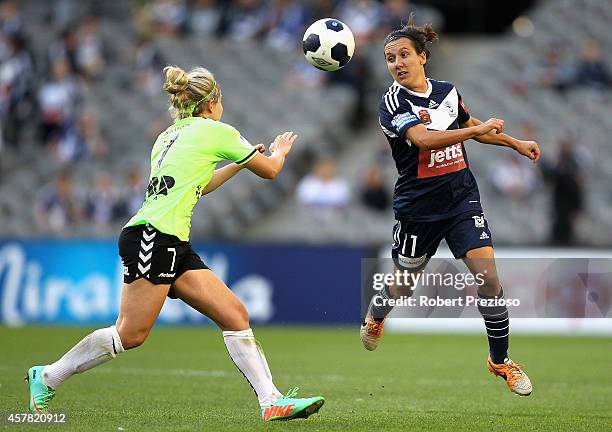 Lisa De Vanna of the Victory heads the ball past Ellie Brush of Canberra during the round seven W-League match between Melbourne and Canberra at...