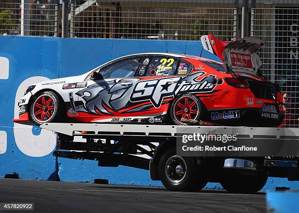 The Holden Racing Team Holden of Greg Murphy and James Courtney is removed from the track after a start line crash, during race 31 for the Gold Coast...