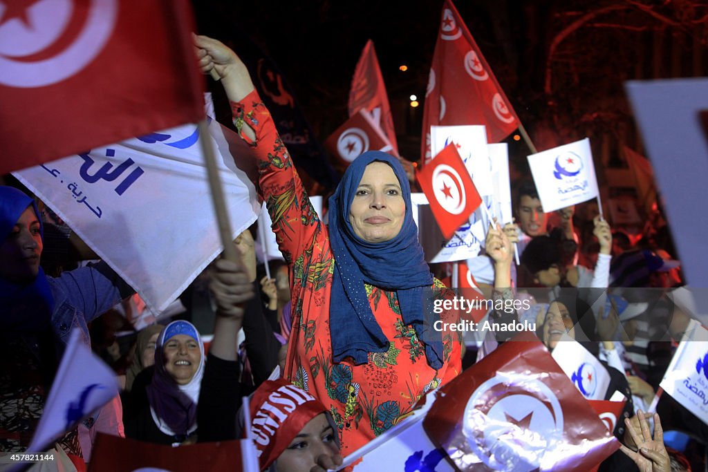 Rashid al-Ghannushi holds a rally ahead of Tunisian parliamentary election