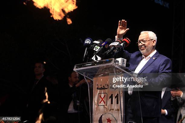 Tunisian En-Nahda Party founder Rashid al-Ghannushi greets the audience during a rally ahead of Tunisian parliamentary election, which will be held...