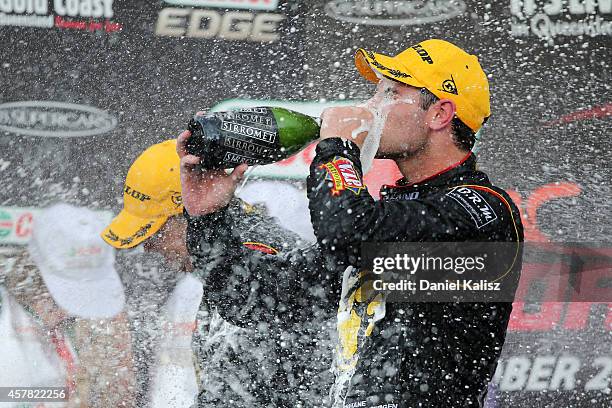 Shane van Gisbergen and Jonathon Webb drivers of the TEKNO VIP Petfoods Holden celebrates after winning race 31 for the Gold Coast 600, which is...