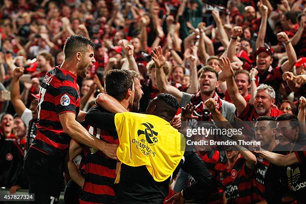 Tomi Juric of the Wanderers celebrates with team mates after scoring a goal during the Asian Champions League final match between the Western Sydney...