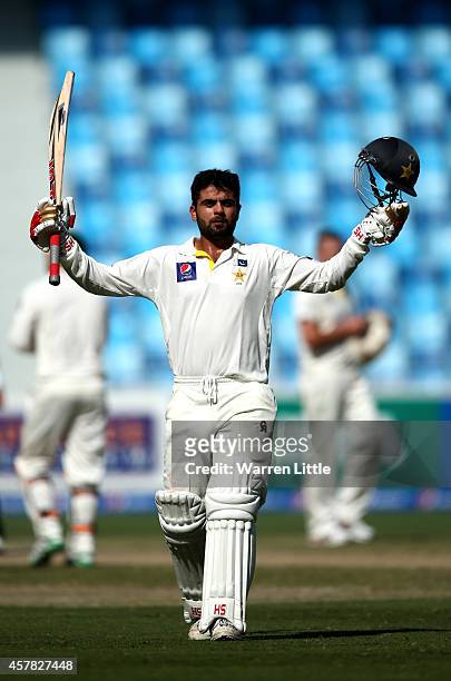 Ahmed Shehzad of Pakistan celebrates as he reaches his century during day four of the First Test between Pakistan and Australia at Dubai...