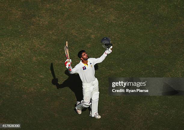 Ahmed Shehzad of Pakistan celebrates after reaching his century during Day Four of the First Test between Pakistan and Australia at Dubai...