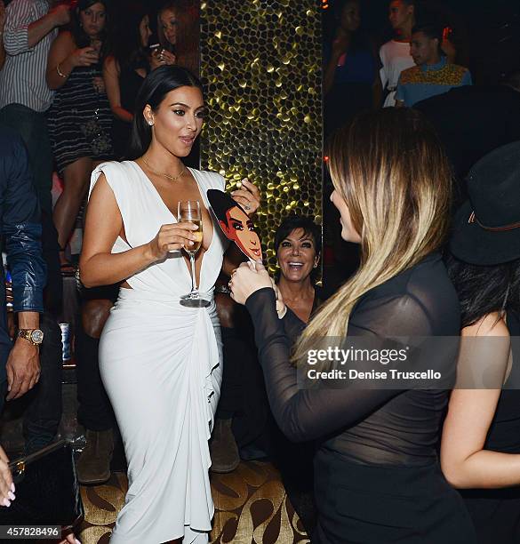 Kim Kardashian West and Khloe Kardashian celebrate Kim's birthday at TAO Nightclub at the Venetian Hotel and Casino on October 24, 2014 in Las Vegas,...