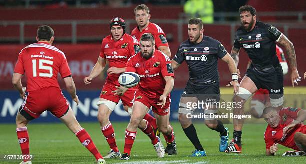 Duncan Casey of Munster passes the ball during the European Rugby Champions Cup match between Munster and Saracens at Thomond Park on October 24,...