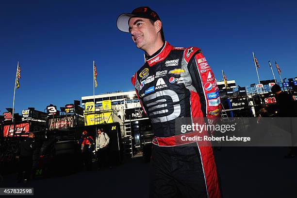 Jeff Gordon, driver of the Drive To End Hunger Chevrolet, stands in the garage area during practice for the NASCAR Sprint Cup Series Goody's Headache...