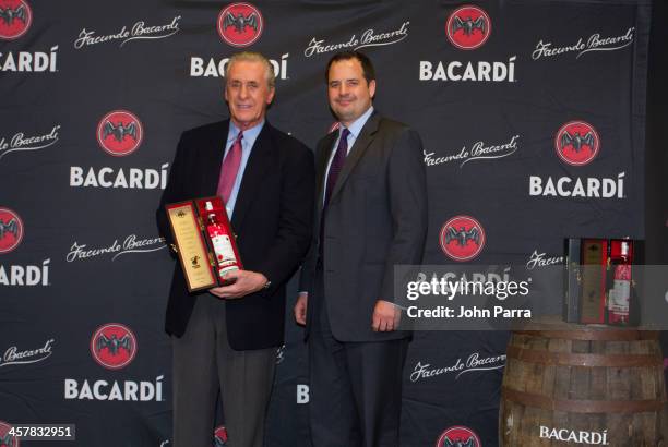 Pat Riley President of the Miami Heat and Toby Whitmoyer Vice President and brand managing director for the rum category at Bacardi USA toast to a...