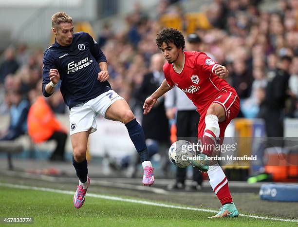 Lee Martin of Millwall comes in to challenge Fabio De Silva of Cardiff during the Sky Bet Championship match between Millwall and Cardiff City at The...