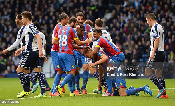 Brede Hangeland of Crystal Palace is mobbed by team mates after scoring the opening goal during the Barclays Premier League match between West...