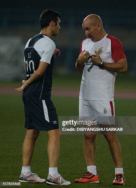 Atletico De Kolkata coach Antonio Lopez Habas talks with footballer and captain Luis Garcia during a training session on the eve of their Indian...