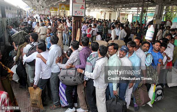 Passengers queue up in front of general compartment of Indore Patna Express, who wanted to go to their native place for the Chhath Puja, on October...