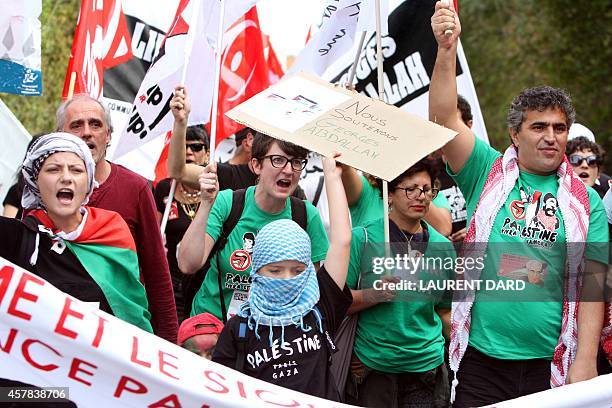 Demonstrators chant slogans and wave flags as around 300 people gather to call for the release of "Lebanese revolutionary" Georges Ibrahim Abdallah...