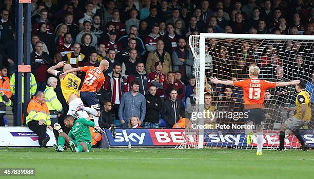 Luke Guttridge of Luton Town scores his sides goal during the Sky Bet League Two match between Luton Town and Northampton Town at Kenilworth Road on...