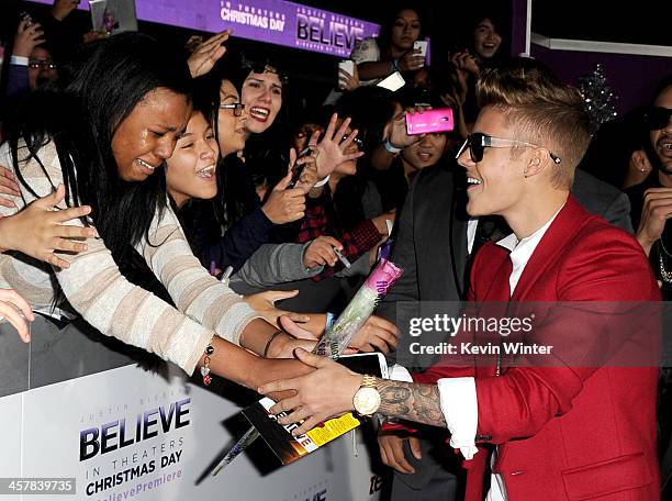 Singer Justin Bieber arrives at the premiere of Open Road Films' "Justin Bieber's Believe" at the Regal Cinemas L.A. Live on December 18, 2013 in Los...