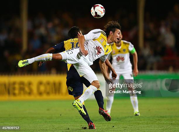 Albert Riera of the Phoenix competes with Marcos Flores of the Mariners for a header during the round six A-League match between the Central Coast...