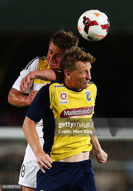 Daniel McBreen of the Mariners competes with Ben Sigmund of the Phoenix during the round six A-League match between the Central Coast Mariners and...