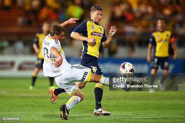 Ben Sigmund of the Phoenix competes with Daniel McBreen of the Mariners during the round six A-League match between the Central Coast Mariners and...