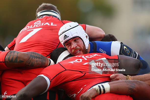 Dave Attwood of Bath pushes in a scrum as Imanol Harinordoquy and Timoci Matanavou of Toulouse surround during the European Rugby Champions Cup Pool...