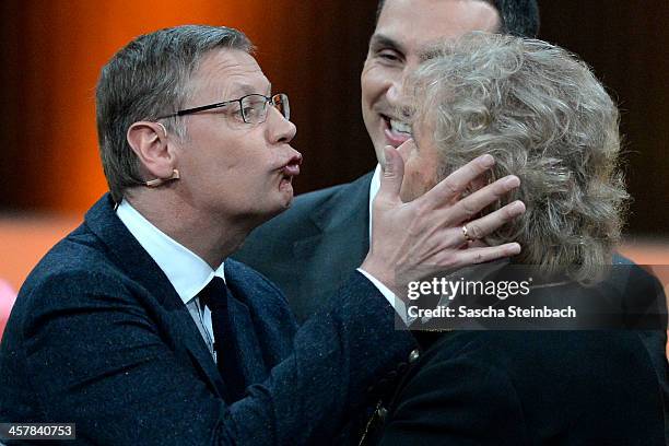 Presenter Guenther Jauch tries to kiss Thomas Gottschalk during the taping of the anniversary show '30 Jahre RTL - Die grosse Jubilaeumsshow mit...