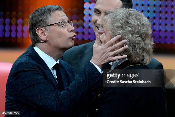 Presenter Guenther Jauch tries to kiss Thomas Gottschalk during the taping of the anniversary show '30 Jahre RTL - Die grosse Jubilaeumsshow mit...