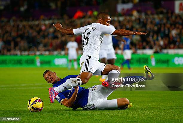 Paul Konchesky of Leicester City tackles Wayne Routledge of Swansea City during the Barclays Premier League match between Swansea City and Leicester...