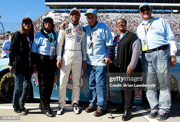 Sybil Scott, Janis Davis, Wendell Scott, Cheryl Ashley and Frank Scott pose with Darrell Wallace, Jr. , driver of the 2015 NASCAR Hall of Fame...