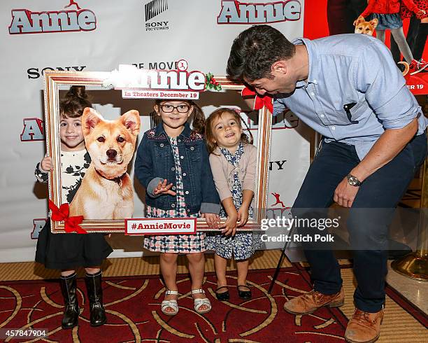 Max Greenfield and daughter Lilly Greenfield with friends at a screening of ANNIE for friends and family at Pacific Theaters at the Grove on October...