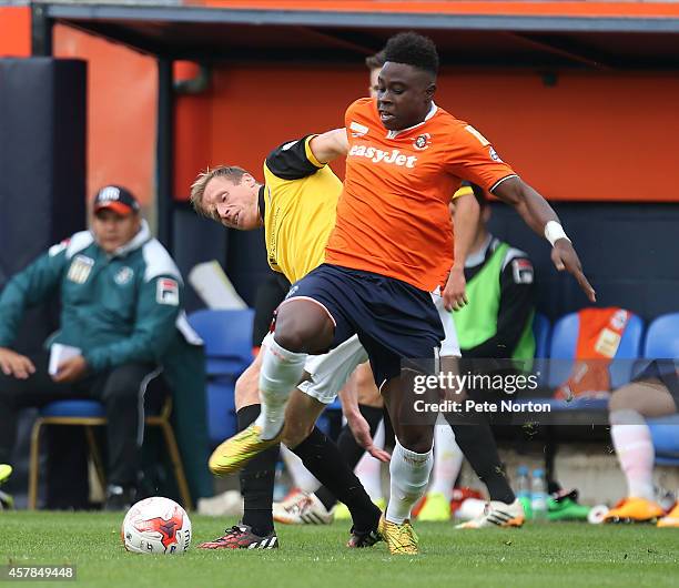 Pelly Ruddock Mpanzu of Luton Town contests the ball with Ricky Ravenhill of Northampton Town during the Sky Bet League Two match between Luton Town...