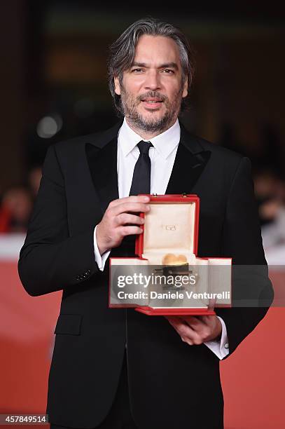 Andrea Di Stefano poses with the Gala Jury Award at the Award Winners Red Carpet during the 9th Rome Film Festival at Auditorium Parco Della Musica...