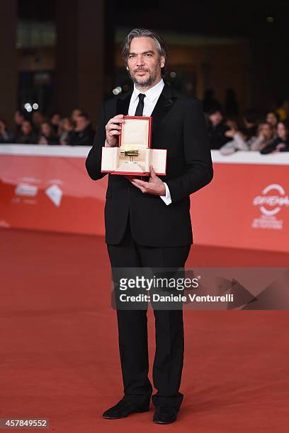 Andrea Di Stefano poses with the Gala Jury Award at the Award Winners Red Carpet during the 9th Rome Film Festival at Auditorium Parco Della Musica...