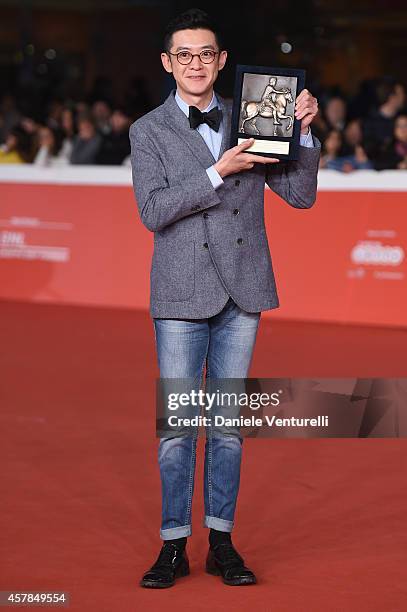 Xu Ang poses with People?s Choice Award Cinema d'Oggi during the Award Winners Photocall during the 9th Rome Film Festival on October 25, 2014 in...